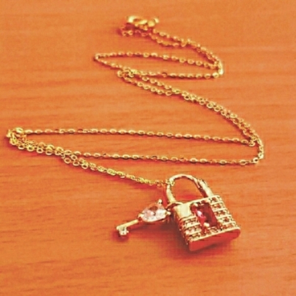 .925 Sterling: 18k gold plated sterling  necklace with key to my heart…